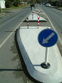 A picture of a concrete pedestrian refuge island. 